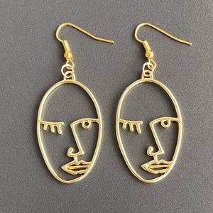 NEW Human Face Earrings in Gold color